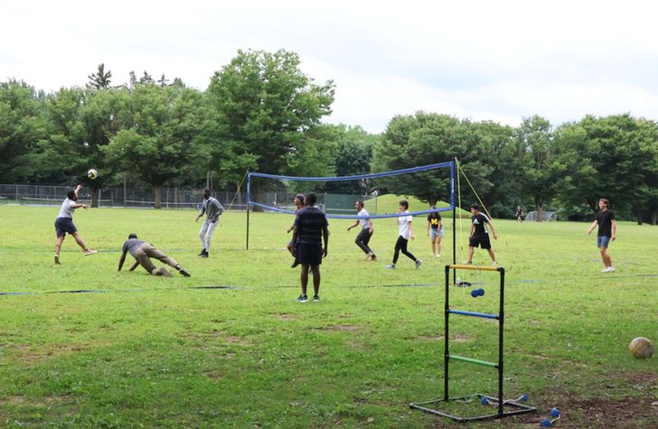 People playing volleyball.