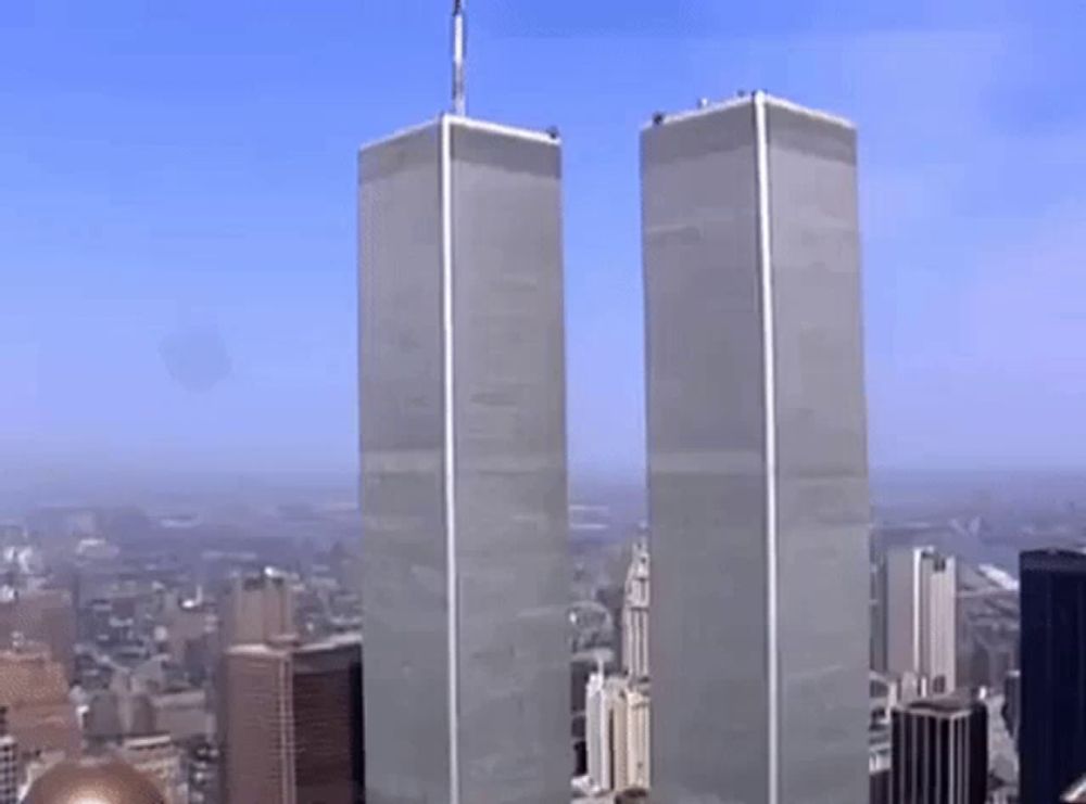 the twin towers of the world trade center are visible in a cityscape