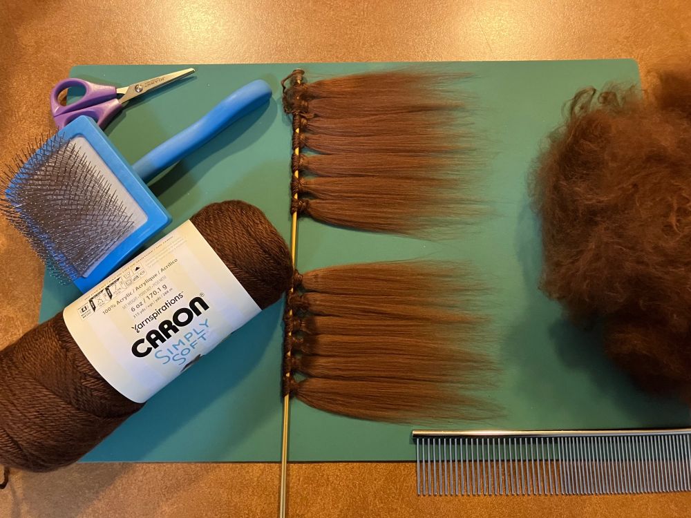 wefts of brown miniature hair made with yarn and a pet brush