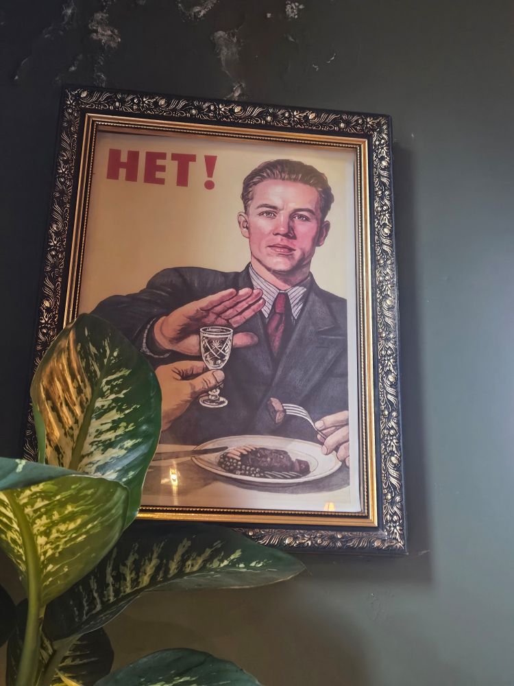 A poster of a Russian man refusing to have a vodka. Soviet propaganda to try and reduce alcoholism...