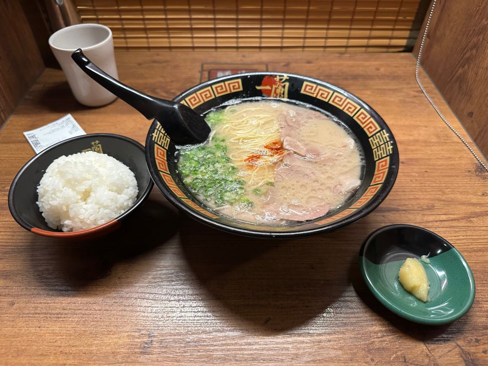 Bowl of ramen, bowl of rice, and side of extra garlic