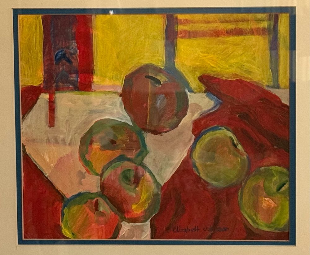 A painting of red and green apples on a white cloth against a red and yellow background.