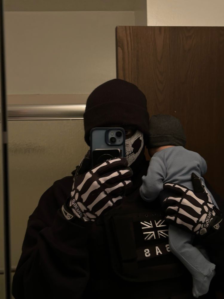 ghost cosplay mirror selfie holding baby