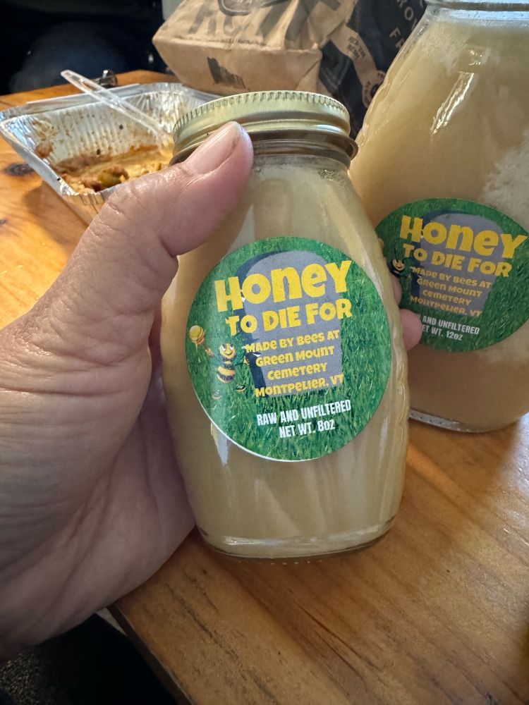 In my hand, a jar of local honey made from the bees of Green Mount Cemetery, Montpelier, VT. 