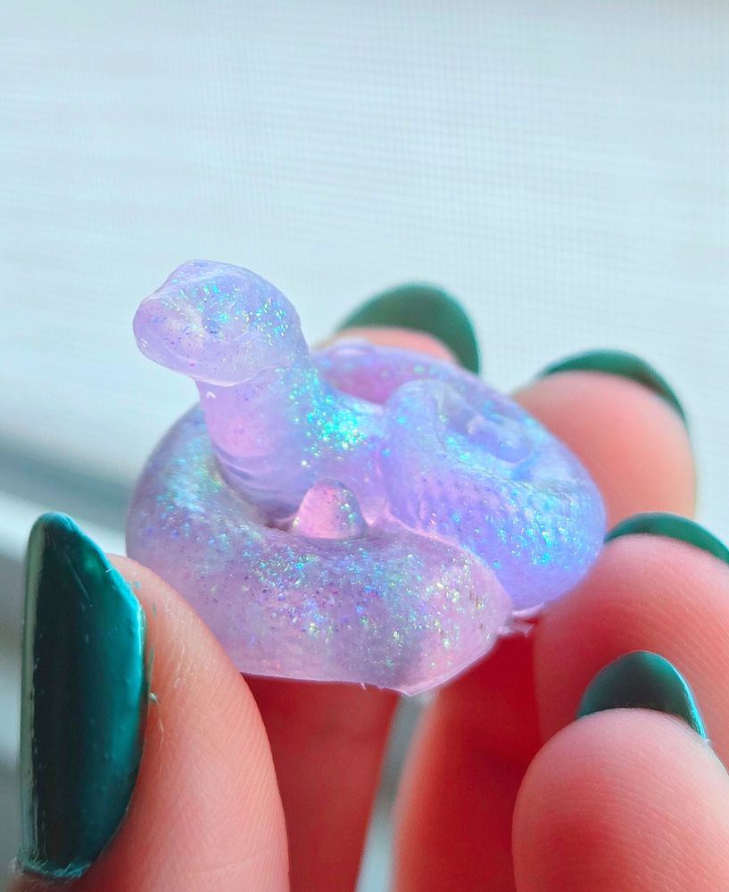 A tiny silicone hognose snake squish that came complimentary with the Obscura dildo.