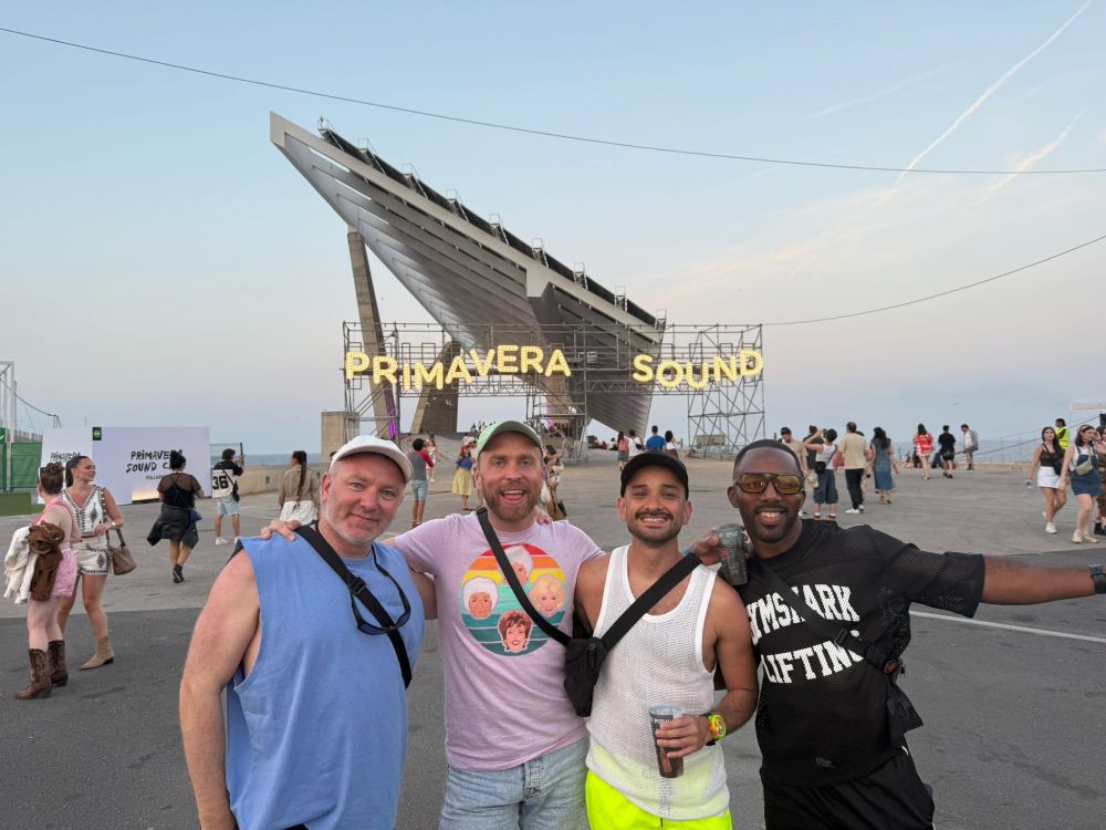 Diego and friends in Primavera Sound. 4 people in front of a structure that says PRIMAVERA SOUND.