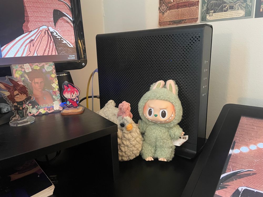 a labubu hanging out with a crochet chicken