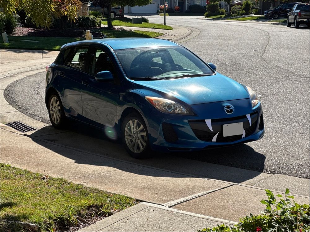 Mazda 3 with fangs from the side