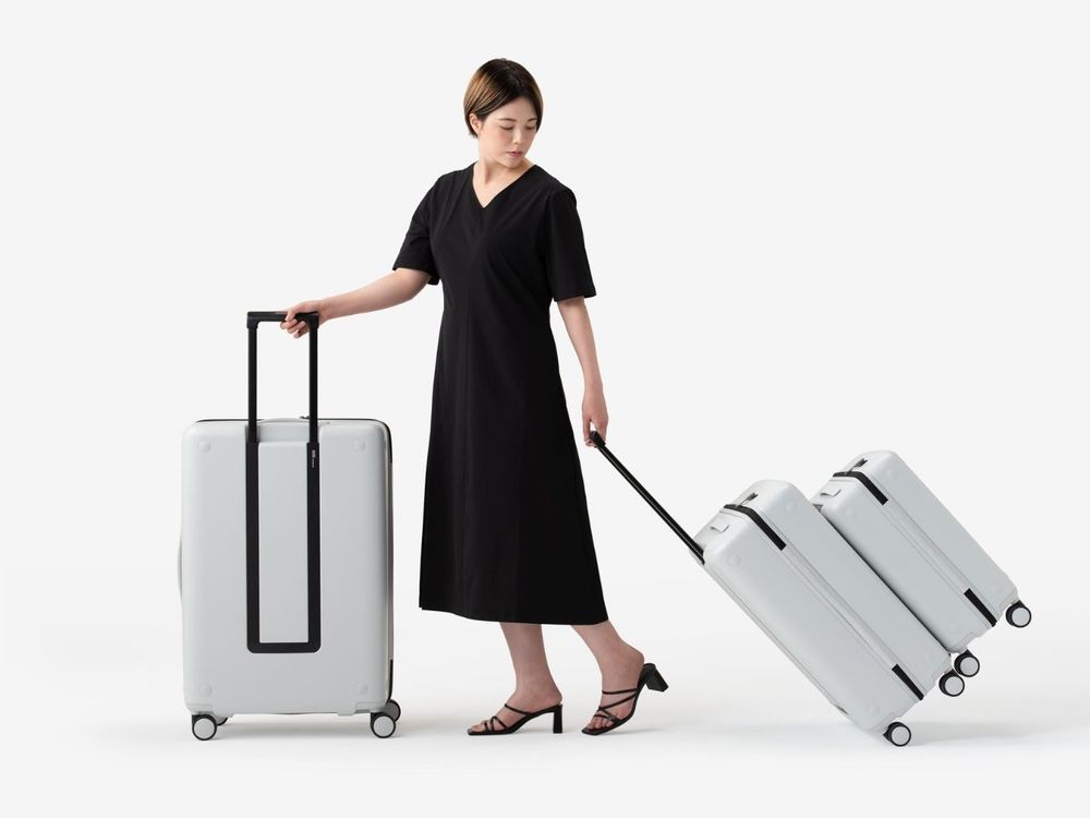 Small luggage attached to a larger one, like an external battery to an iPhone via MagSafe.