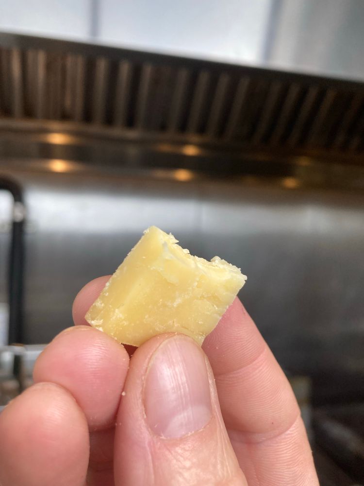 the last bite of my sampler chonk of aged cheddar 
