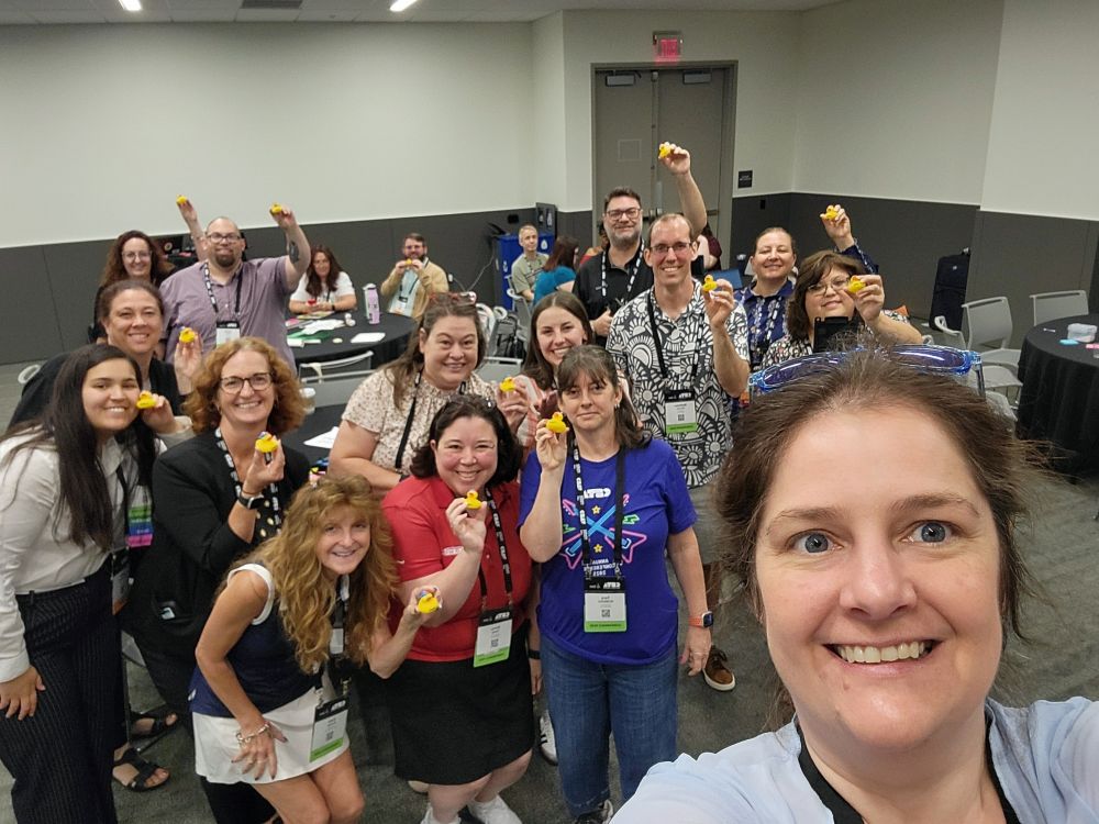 CSTA workshop participants holding yellow rubber ducks