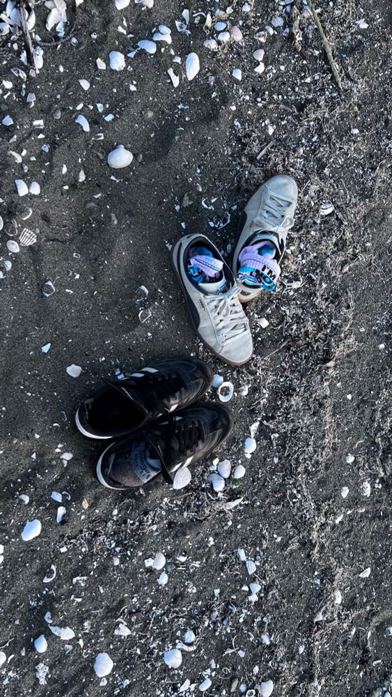 Shoes on the beach during paddle boarding. 