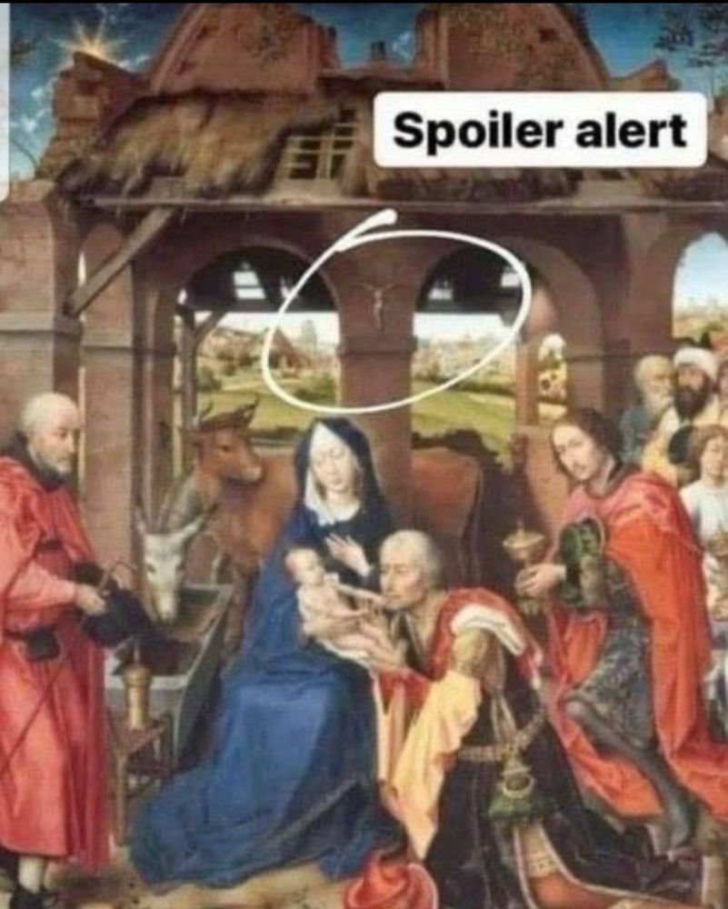 A painting of the birth of Christ where there’s a crucifix hanging on the manger that’s circled with the words “SPOILER ALERT” printed next to it