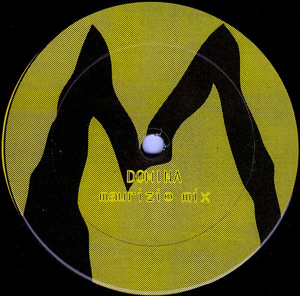 The label art for Maurizio’s ‘Domina’ 12”. A solid yellow circle with a crookedly paint black M in it