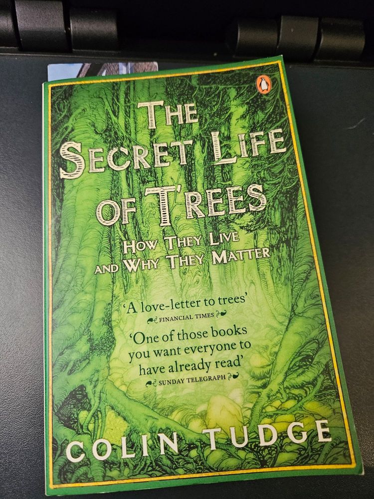 The front cover of the book "The Secret Life of Trees" by Colin Tudge