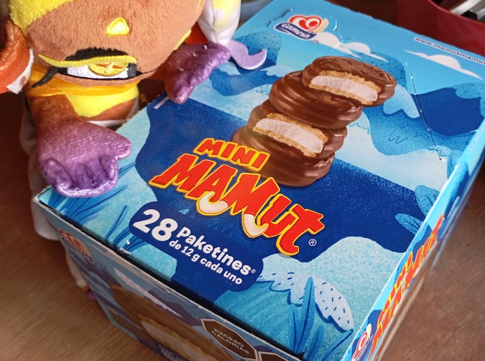 A picture of Frye about to open a box of "Mini Mamuts" which is a marshmallow filled cookie covered with chocolate
They fucking rule i love them cant wait to have some