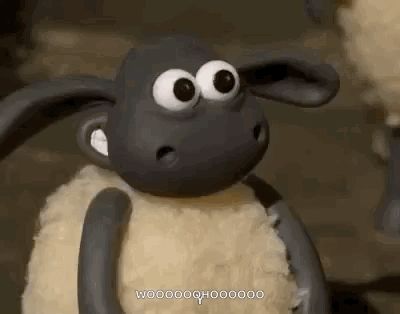 a close up of a cartoon sheep with big eyes and a surprised look on his face .