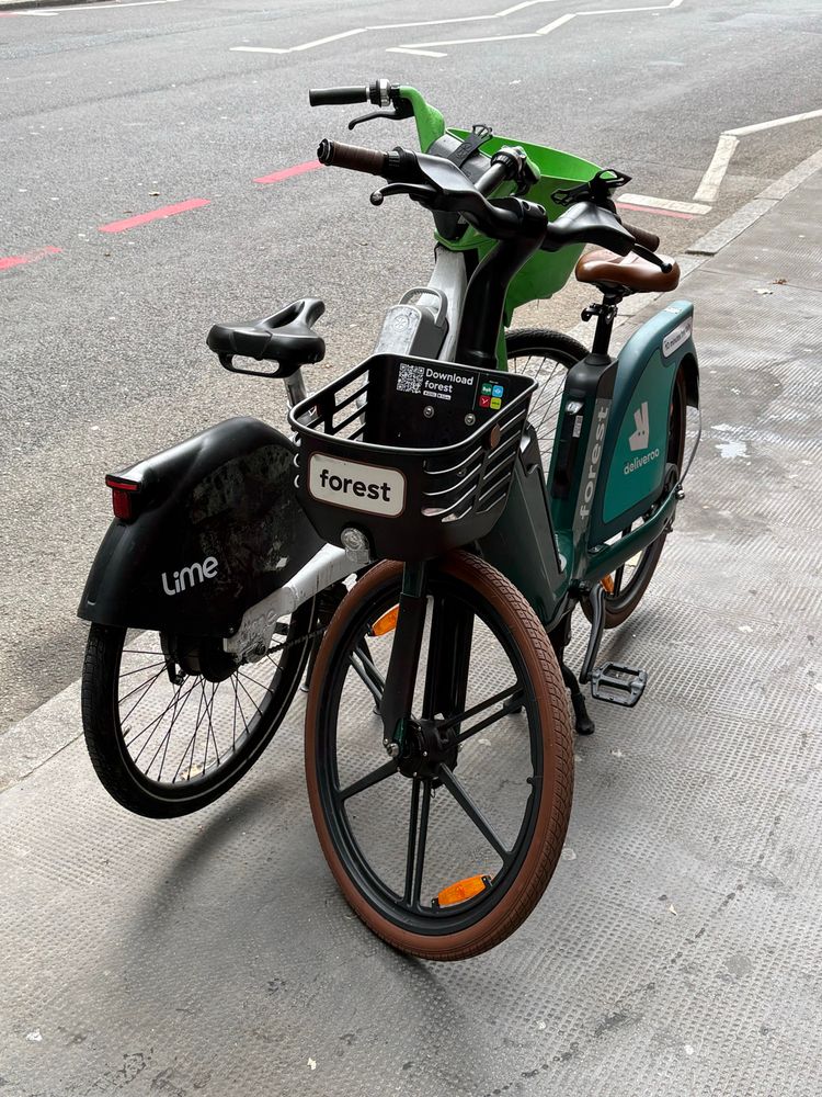 forest e-bike and lime e-bike parked together 