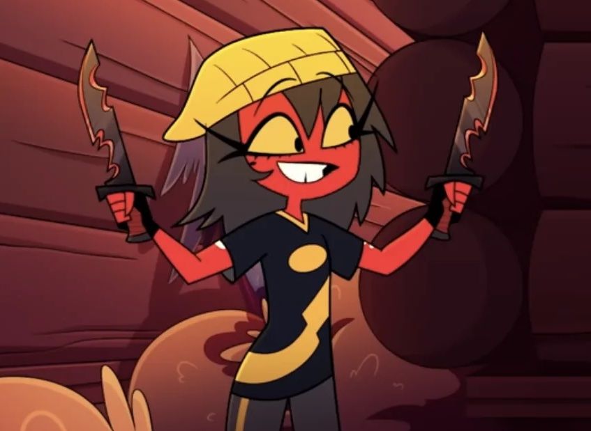 Millard holding up two knives excitedly