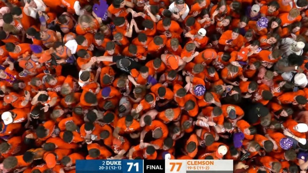 Clemson students storm the court after upsetting second ranked Duke in men’s basketball on Saturday, February 8, 2025.
