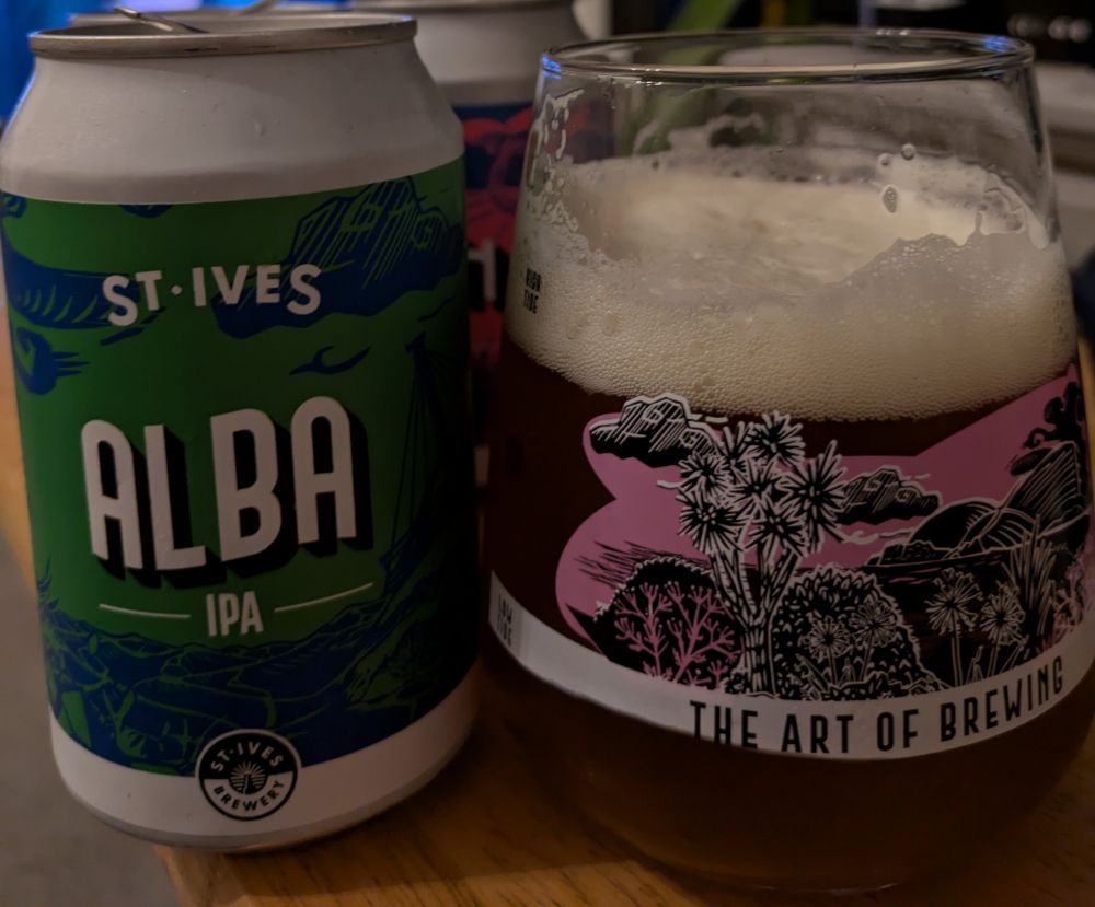A beer can and a glass of beer 
