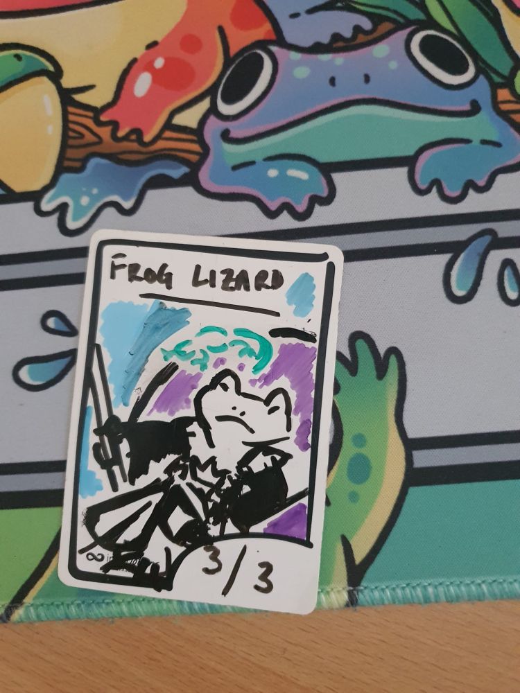 Tokentokber day 5: 3/3 Frog Lizard

A hand-drawn token depicting Glarb - a frog in ruined noble finery and holding a staff, reclined on a throne. On the back of the throne is a lizard. 