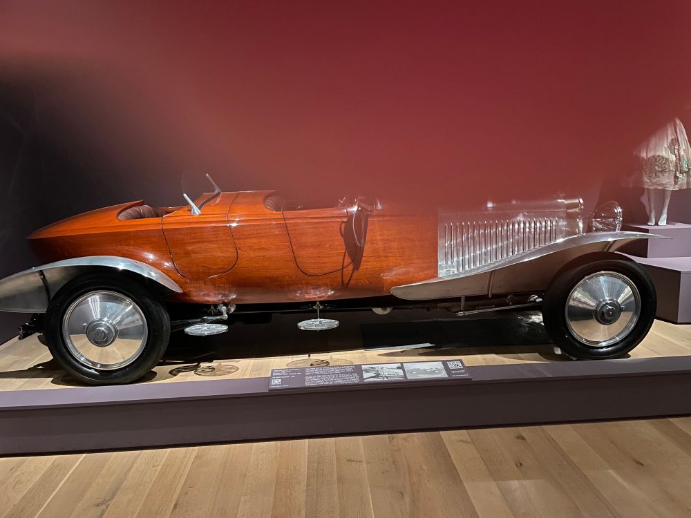 Brown wood veneer sleek car with silver details. 