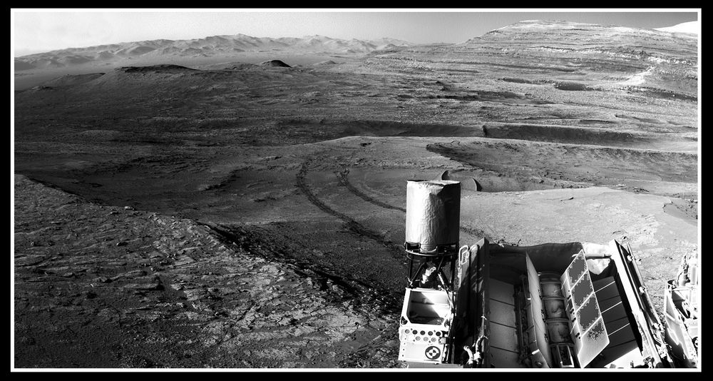 new view of Mars, sent back from the slopes of Mt Sharp by Curiosity just a few hours ago, looking over her shoulder at the floor & distant rim, of Gale Crater