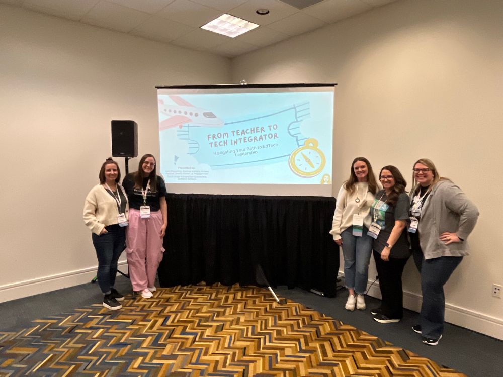 5 presenters posing with the title slide of From Teacher to Tech Integrator at the MACUL conference