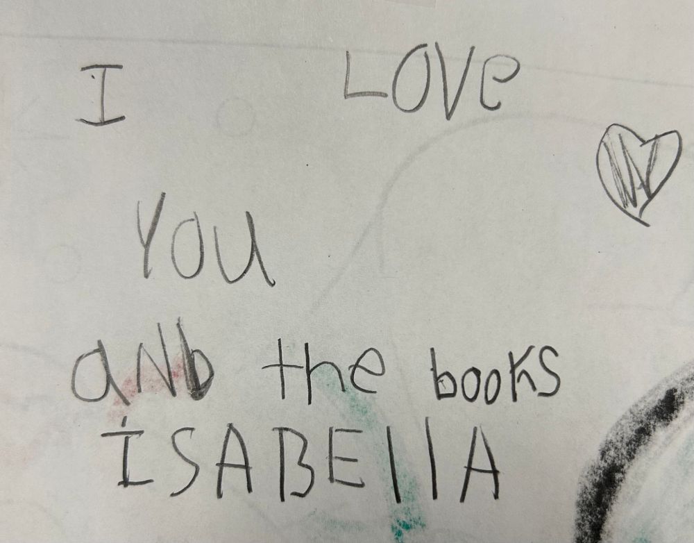 A student named Isabella wrote “I love you and the books” and added a heart. 