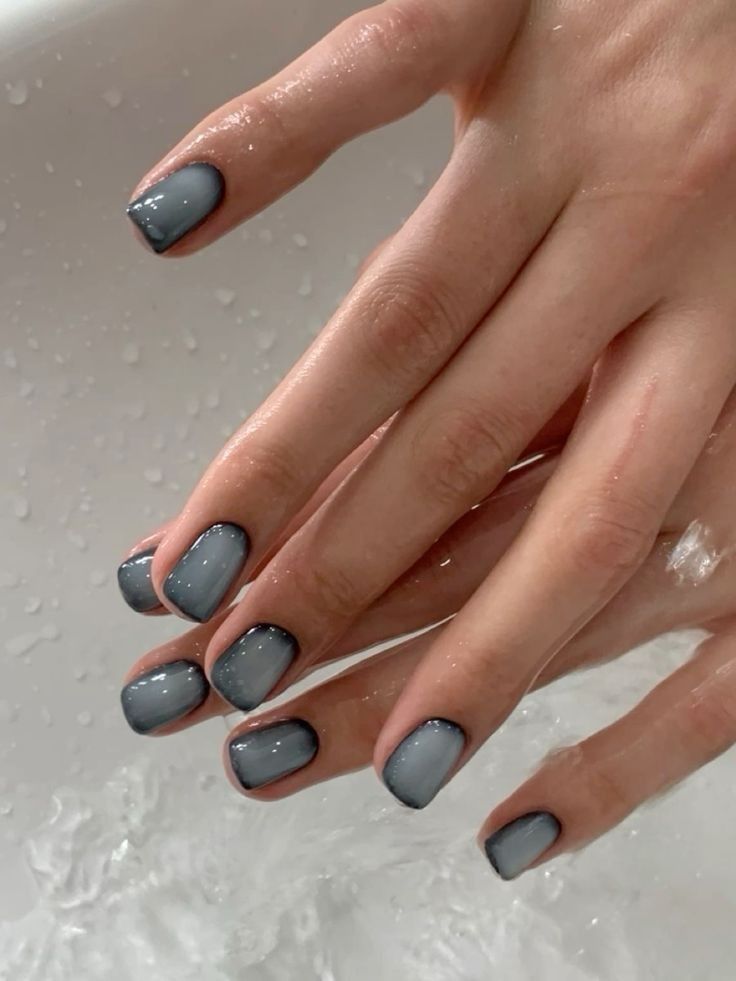picture of manicure that has mostly black nails