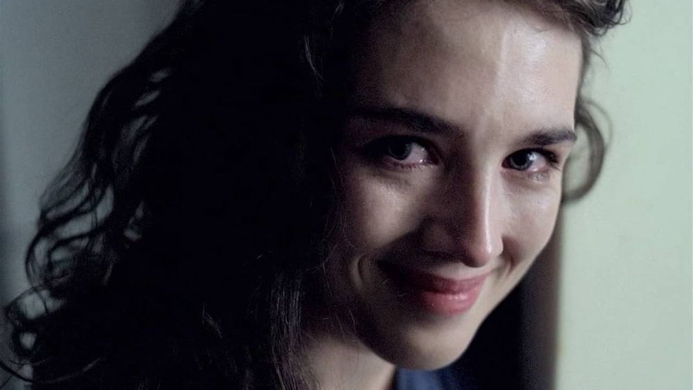 Isabelle Adjani in Possession (1980) smiling with tears in her eyes