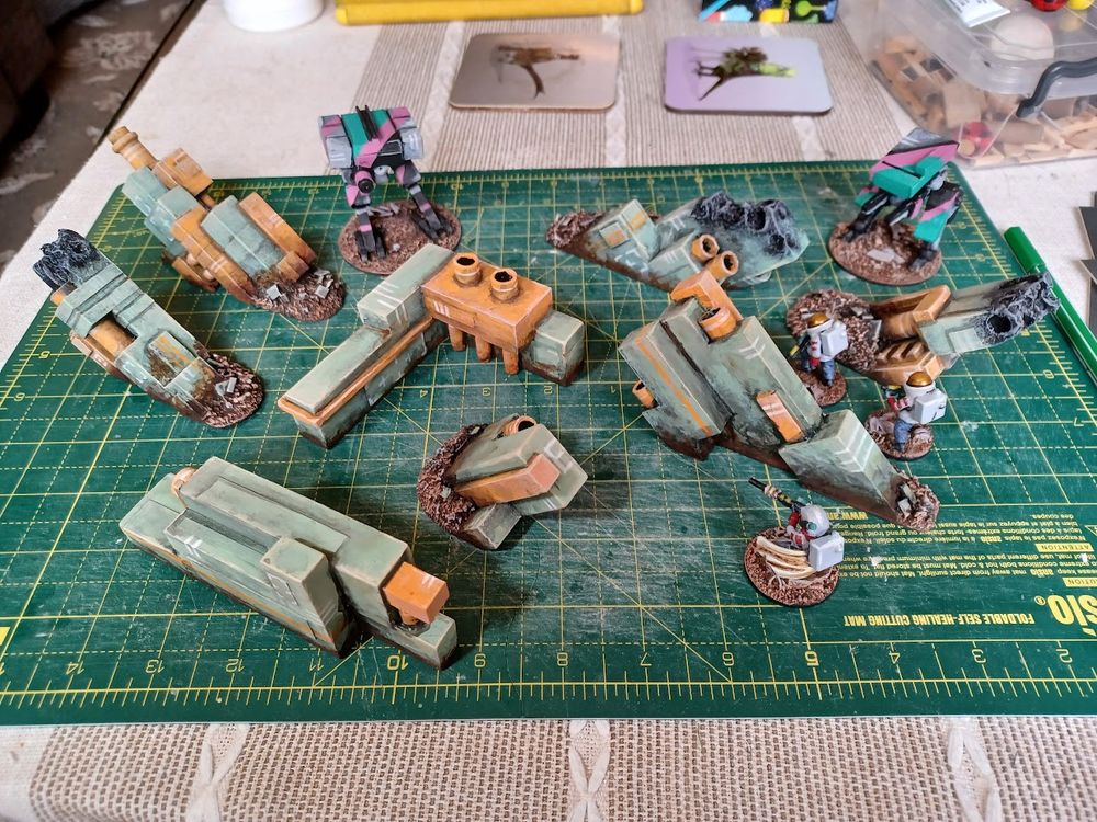 Bunch of blocky model walls with a couple miniatures