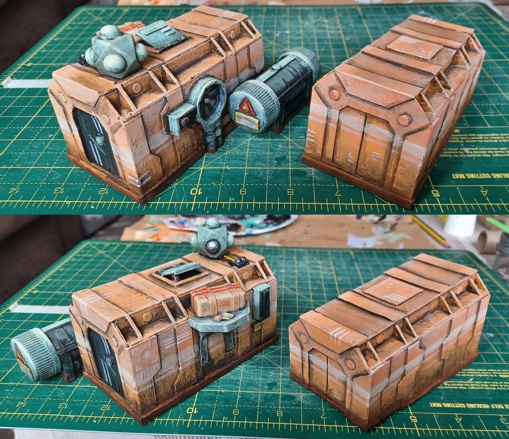 Two sci-fi model shipping containers, painted orange.