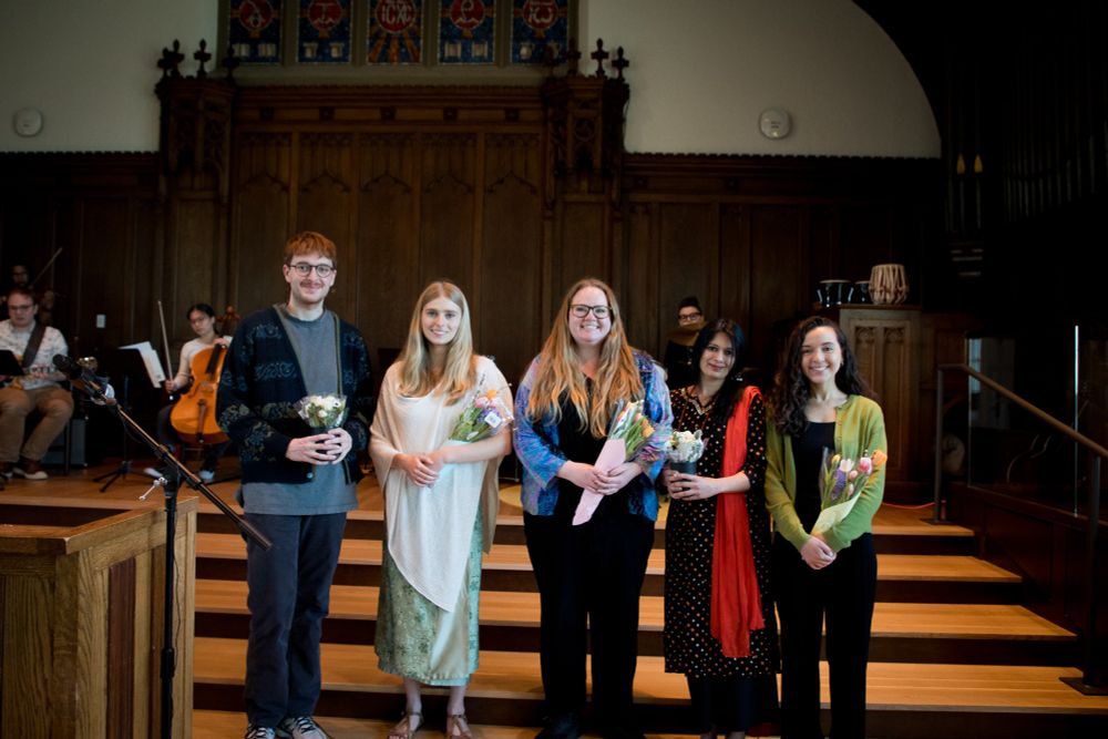 Finalists stand in the Williams Chapel with their flowers