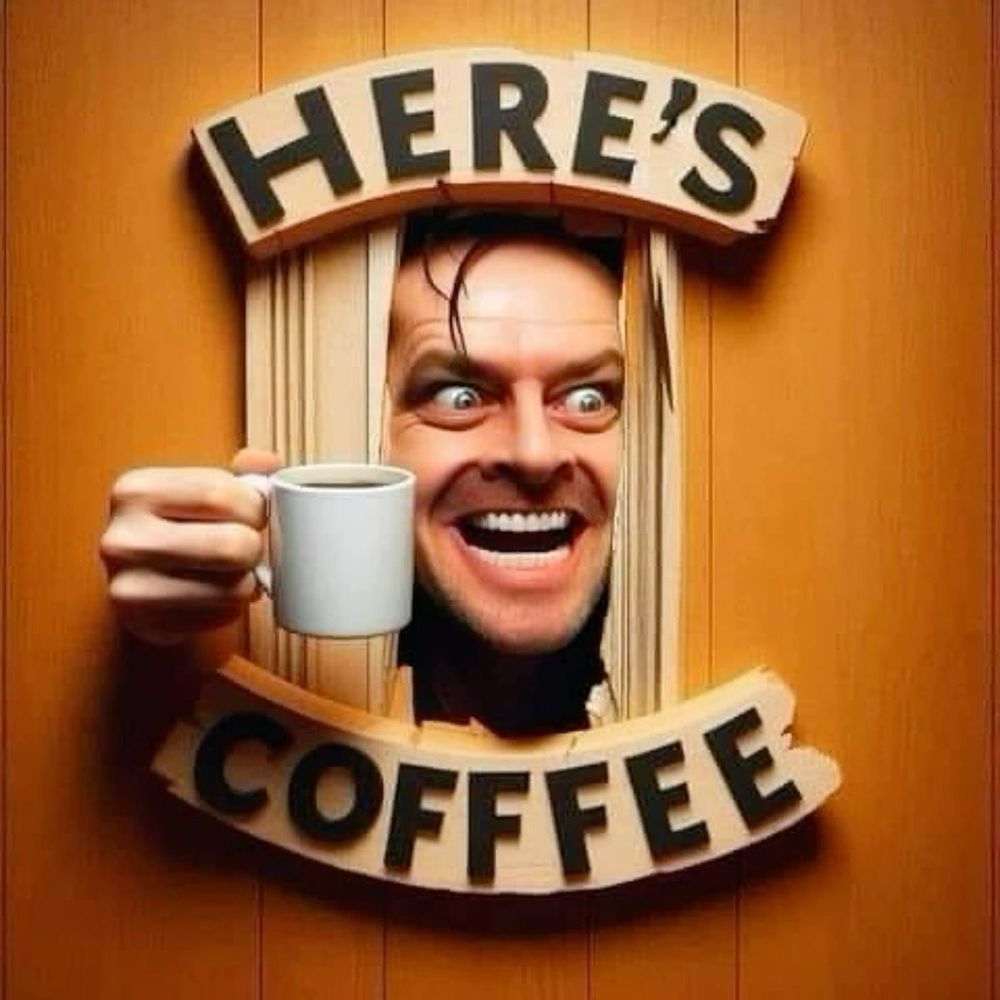 Hand hält weiße Kaffeetasse durch rechteckige Öffnung in Holzwand mit Text 'HERE'S COFFEE'.

Main tenant une tasse blanche de café à travers une ouverture rectangulaire dans un mur en bois avec le texte 'HERE'S COFFEE'.

Hand holding white coffee cup through rectangular opening in wooden wall with text 'HERE'S COFFEE'.