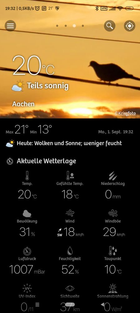 Screenshot einer Wetter-App mit Temperatur 20°C, Standort Aachen. Wettervorhersage zeigt Wolken und Sonne, weniger Feuchtigkeit. Aktuelle Wetterdaten: gefühlte Temperatur 18°C, Wind 18 km/h, Luftdruck 1007 hPa.