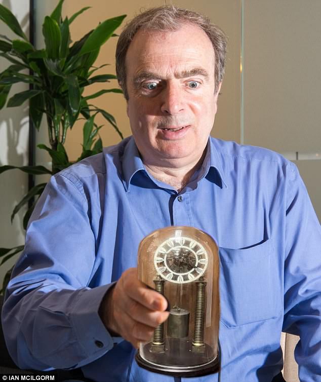 peter hitchens staring slightly derangedly at an old clock like it’s the ark of the covenant