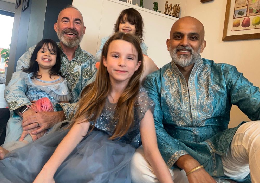 A little family in their best outfits for Diwali