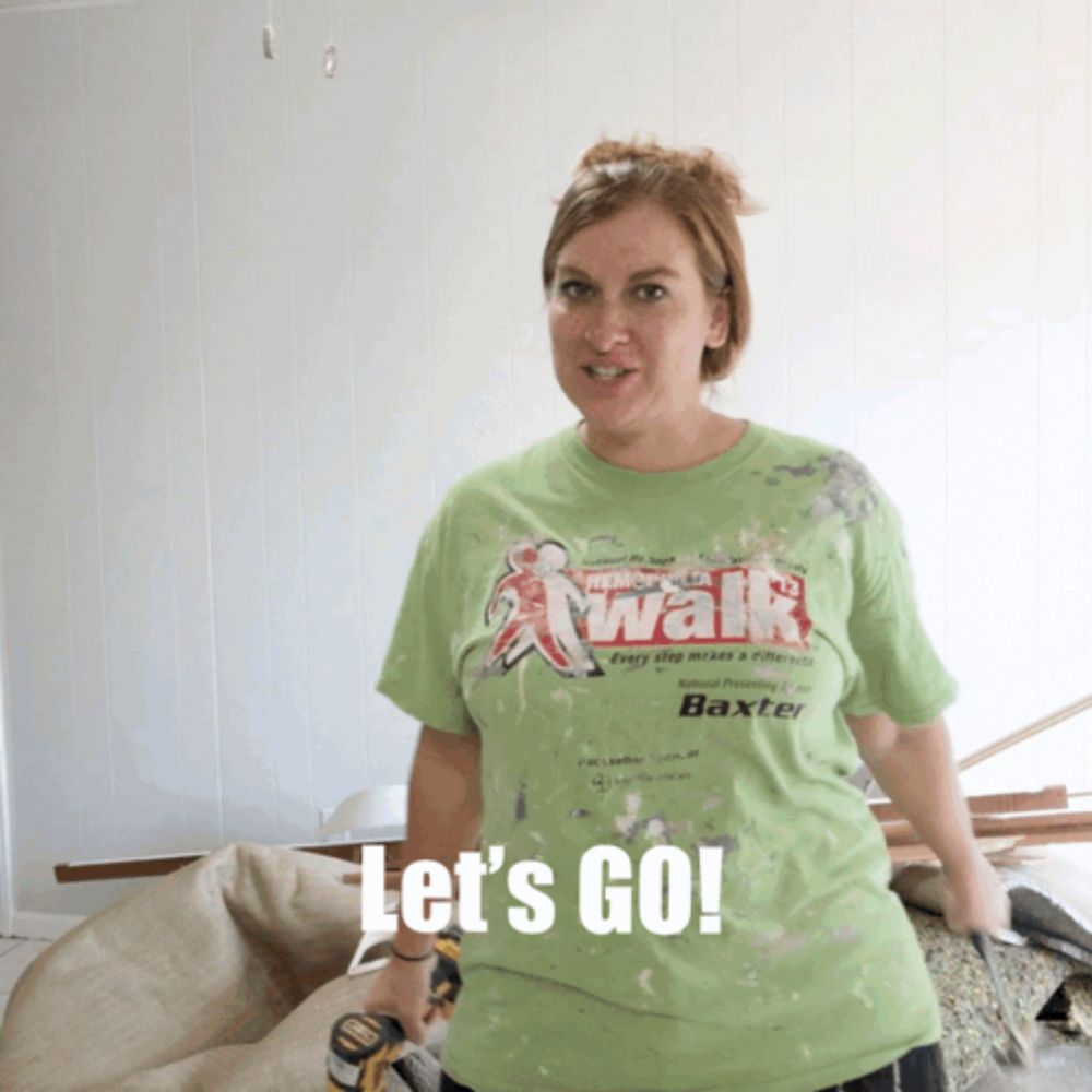 a woman wearing a green shirt that says let 's go on it