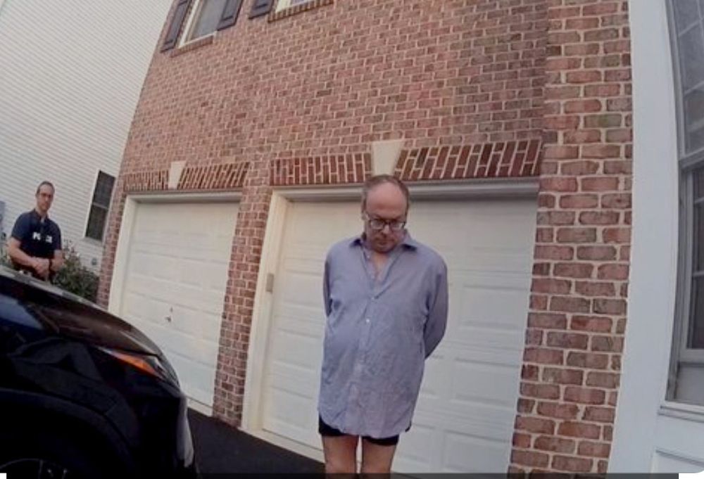 Photo of Jeff Clark, an attorney linked to the former 45th President, outside of his home, while he’s getting arrested, and has no pants on. 