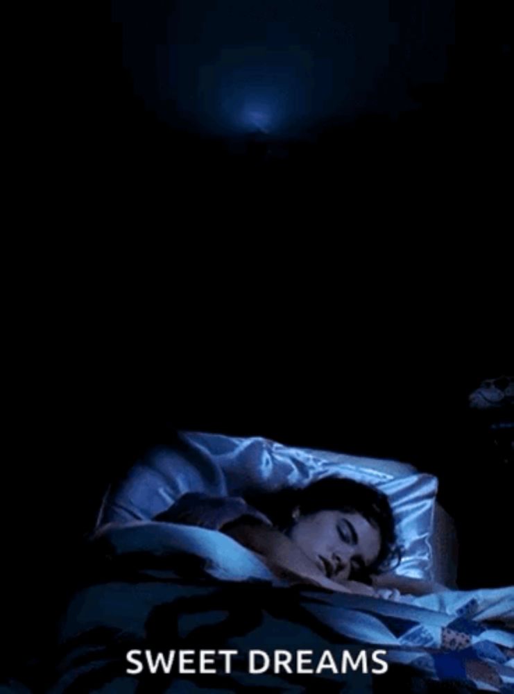 a poster for sweet dreams shows a woman sleeping in a bed