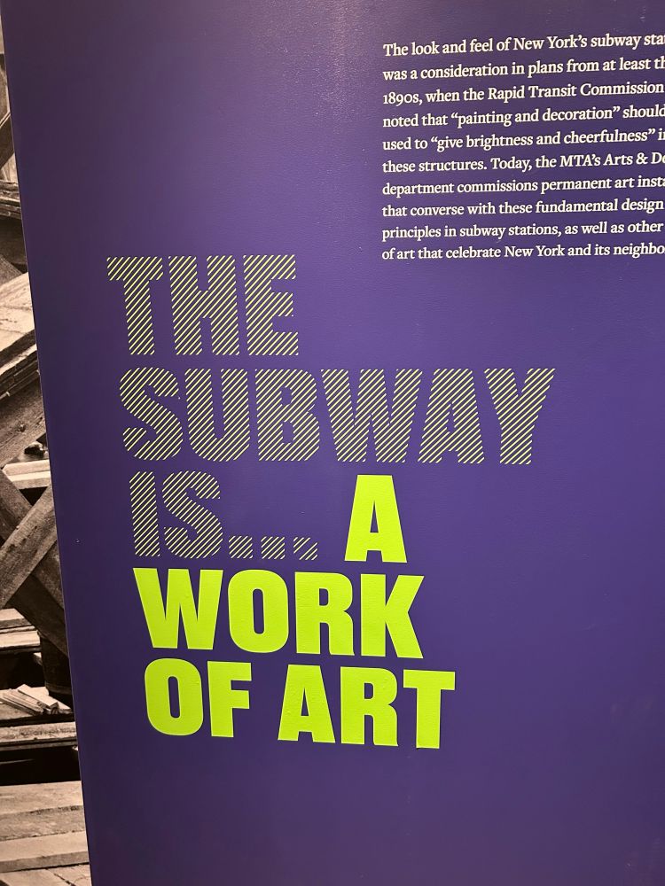 An exhibit sign at the New York Transit Museum that says “The subway is… a work of art”