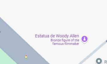 google maps showing a pin for 
Estatua de Woody Allen
bronze figure of the famous filmmaker