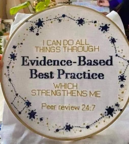 Round embroidery piece in a hoop, blue and gold stars around the perimeter.

Text reads: "I can do all things through evidence based best practice whicH strengthens me.  Peer Review 24:7"