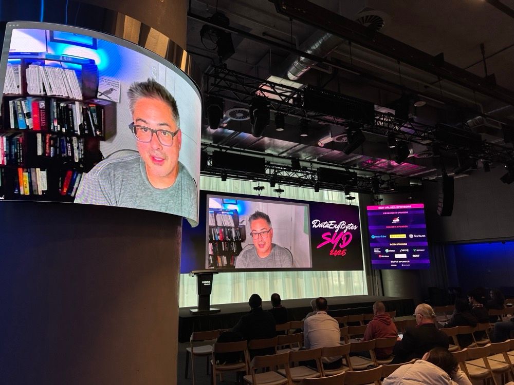 A man dialling in via Zoom to a tech conference