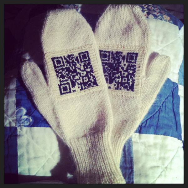 Mittens with a QR code knitted on them