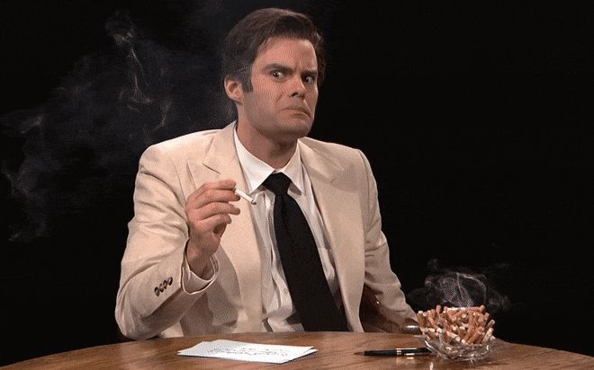 Bill Hader in character, nervously chain-smoking cigarettes 