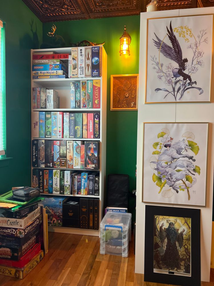 Boardgame shelf with photos.