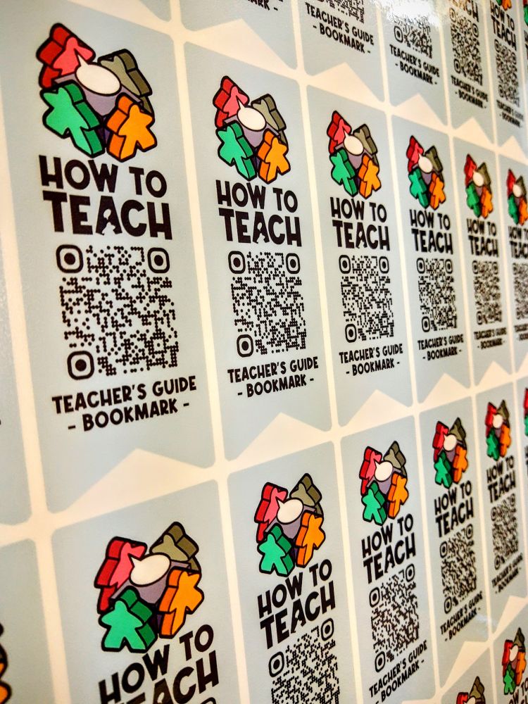 Uncut sheet of stickers. Stickers are shaped like a bookmark and feature JC's How To Teach logo and a QR code for his content